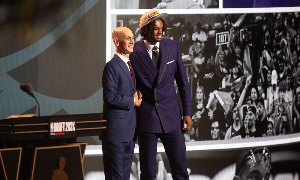 DaRon Holmes II poses for a photo with NBA Commissioner Adam Silver after being selected with the No. 22 pick in the NBA Draft on Wednesday, June 26, 2024, at the Barclays Center in Brooklyn, N.Y. David Jablonski/Staff