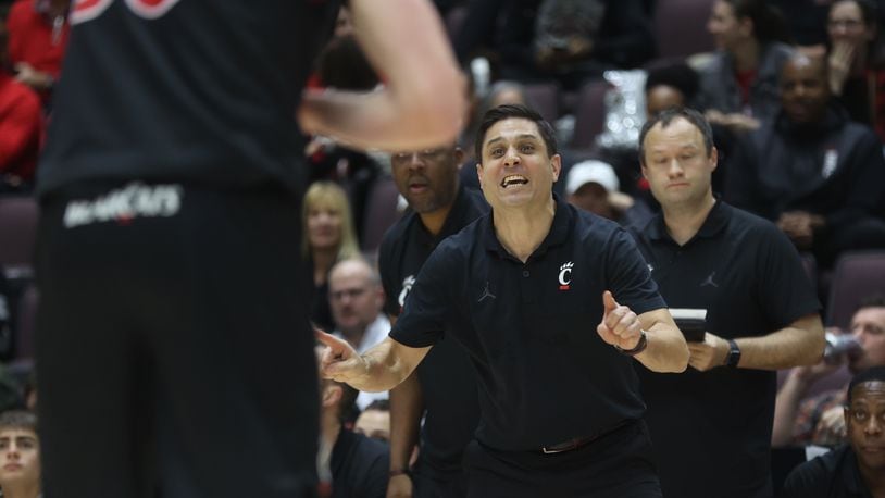 Cincinnati's Wes Miller coaches during a game against Dayton on Saturday, Dec. 16, 2023, at the Heritage Bank Center in Cincinnati. David Jablonski/Staff