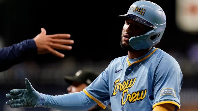 Milwaukee Brewers' Jackson Chourio is congratulated after hitting an RBI single during the fourth inning of a baseball game against the New York Mets, Friday, Sept. 27, 2024, in Milwaukee. (AP Photo/Aaron Gash)