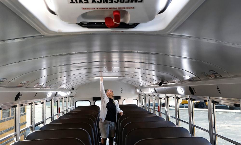 Centerville bus driver Janelle Kime checks the emergency exits and goes through her safety checks Tuesday, Aug. 20, 2024 on her bus before picking students. These checks are done every day. MARSHALL GORBY\STAFF