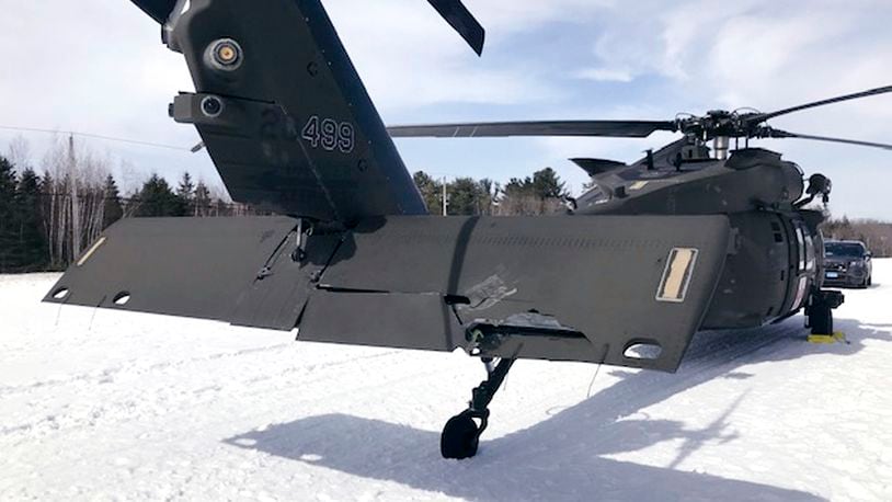 FILE - This U.S. Army photograph by attorney Douglas Desjardins shows a damaged Black Hawk helicopter resting ing the snow, March 13, 2019, in Worthington, Mass. (U.S. Army photograph provided by attorney Douglas Desjardins via AP, File)