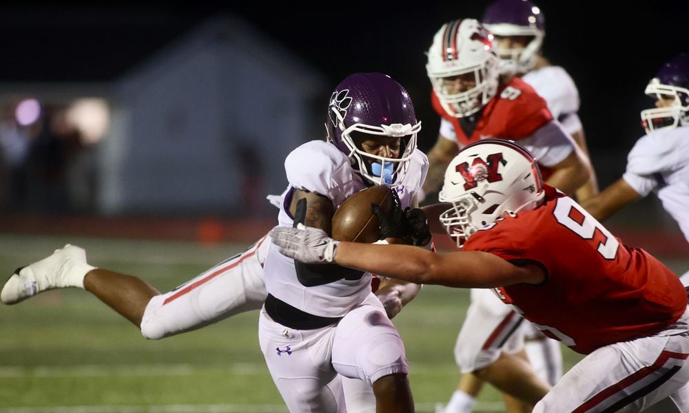 Pickerington Central's Kaejuan Alexander is tackled by Wayne's JD Bryant on Friday, Aug. 30, 2024, at Heidkamp Stadium in Huber Heights. David Jablonski/Staff