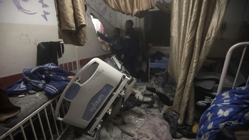 FILE - Palestinian paramedics inspect damage in the patient rooms caused by the Israeli strikes on the maternity ward at Nasser Hospital in the town of Khan Younis, southern Gaza Strip, Sunday, Dec. 17, 2023. (AP Photo/Mohammed Dahman, File)