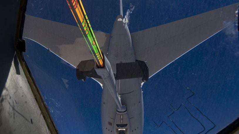 A 22nd Air Refueling Wing KC-46A Pegasus refuels a C-17 Globemaster III from Joint Base Lewis McChord, Alaska s 62nd Airlift Wing over the Arabian Gulf, Nov. 23, 2019. The flight, which offered familiarization with the KC-46A for Qatar Emiri Air Force leadership and personnel, marked the first Pegasus refueling mission in the U.S. Central Command area of operations. (U.S. Air Force photo by Staff Sgt. Daniel Snider)