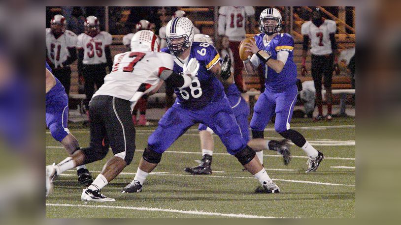 Senior Taylor Decker (68) holds of junior Trevon Williams-Brown (17) while senior quarterback Ryne Pugh (7) prepares to pass as the Trotwood Rams play the Vandalia-Butler High School Aviators at Memorial Field in Vandalia, Friday, October 28, 2011. DDN FILE