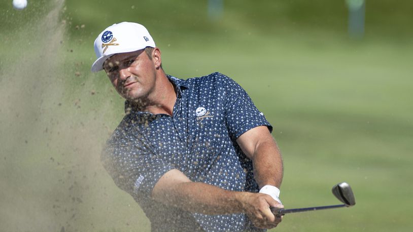 Captain Bryson DeChambeau, of Crushers GC, hits from a bunker on the 12th hole during the first round of LIV Golf Chicago at Bolingbrook Golf Club, Friday, Sept. 13, 2024, in Bolingbrook, Ill. (Matthew Harris/LIV Golf via AP)