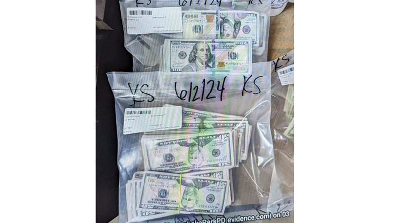 FILE - This image provided by the U.S. Attorney's Office for Minnesota, shows cash from a bag that was left at the home of a juror in a massive fraud case, June 2, 2024, outside Minneapolis, Minn. (U.S. Attorney's Office for Minnesota via AP, File)