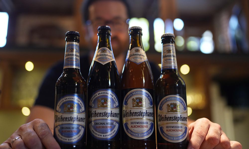 Head Brewmaster Tobias Zollo poses behind non alcoholic beer at the Weihenstephan brewery in Freising, Germany, Friday, Sept. 20, 2024. (AP Photo/Matthias Schrader)