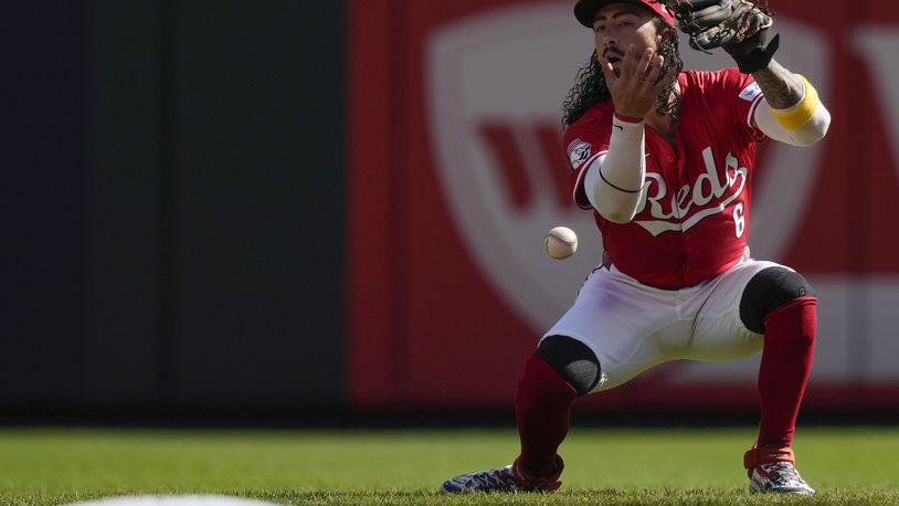 Cincinnati Reds second baseman Jonathan India drops a fly ball hit by Houston Astros' Yordan Alvarez during the first inning of a baseball game, Monday, Sept. 2, 2024, in Cincinnati. (AP Photo/Carolyn Kaster)