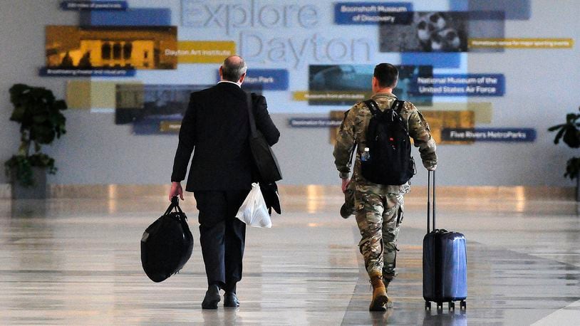 Travelers walk through Dayton International Airport Thursday, June 27, 2024. MARSHALL GORBY/STAFF