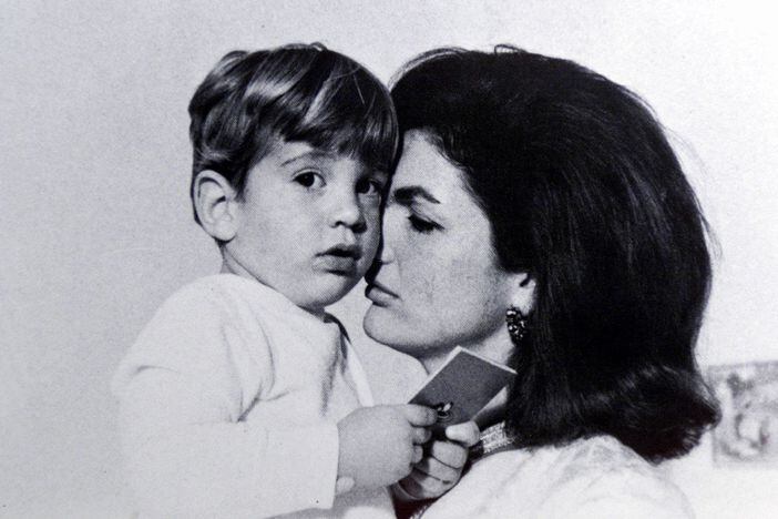 Jacqueline Kennedy holds her young son, John F. Kennedy, Jr. in the White House nursery before putting him to bed. John F. Kennedy, Jr. was missing along with his wife and her sister in a probable airplane accident. - CECIL STOUGHTON