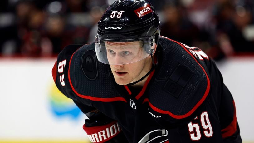 FILE - Carolina Hurricanes' Jake Guentzel (59) watches the puck during the second period of an NHL hockey game against the Boston Bruins in Raleigh, N.C., April 4, 2024. The Tampa Bay Lightning got a head start on free agency by acquiring the rights to high-scoring winger Guentzel. The Lightning sent a 2025 third-round draft pick to Carolina on Sunday, June 30. (AP Photo/Karl B DeBlaker, File)