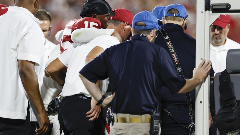 Oklahoma head coach Brent Venables helps defensive back Kendel Dolby (15) onto the medical vehicle following an injury play during the second quarter of an NCAA college football game against Tennessee, Saturday, Sept. 21, 2024, in Norman, Okla. (AP Photo/Alonzo Adams)