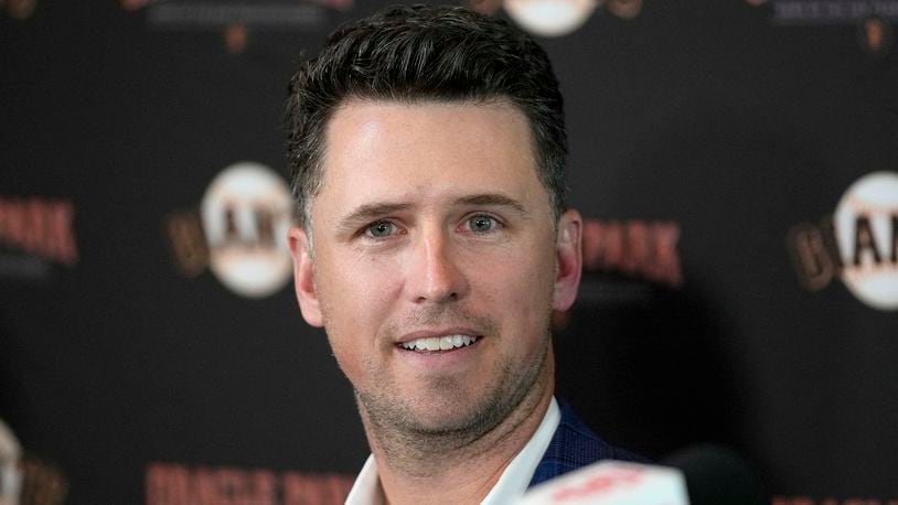 FILE - San Francisco Giants catcher Buster Posey talks during a news conference, Nov. 4, 2021, in San Francisco. (AP Photo/Tony Avelar, file)