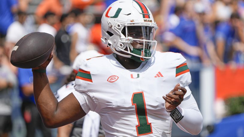 Miami quarterback Cam Ward warms up before an NCAA college football game against Florida, Saturday, Aug. 31, 2024, in Gainesville, Fla. (AP Photo/John Raoux)