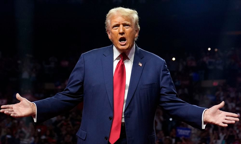 Republican presidential nominee former President Donald Trump gestures at a campaign rally at the Desert Diamond Arena, Friday, Aug. 23, 2024, in Glendale, Ariz. (AP Photo/Evan Vucci)