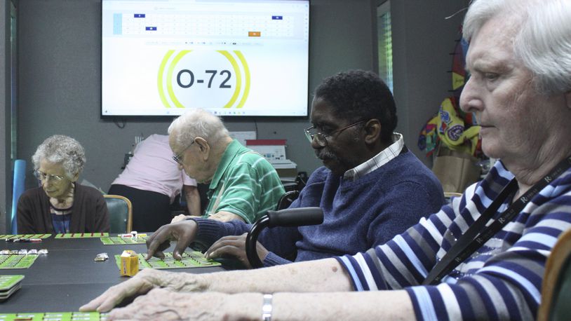 Eberline Nugent, left, Johnny Griffin, Jay Cossey and Carrie Dickson play bingo during activity time at The Retreat at Kenwood assisted living facility in Texarkana, Texas on Friday, May 17, 2024. Cossey recalls, “My brother came and said he wanted to take me home. ... I told him I am home. I’m home because I feel good here.” (AP Photo/Mallory Wyatt)