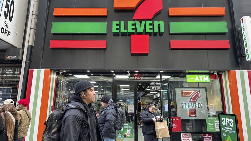 FILE - People shop at a 7-Eleven convenience store in New York, Tuesday, March 19, 2024. (AP Photo/Ted Shaffrey)