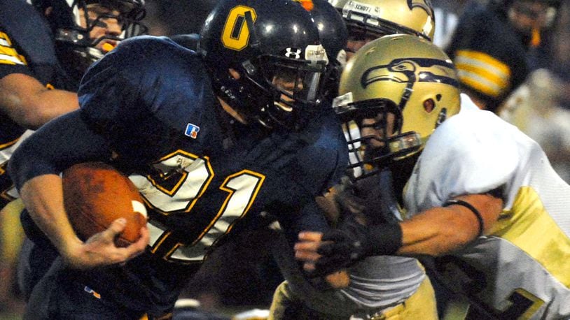 Oakwood's Chris Hardy (21) runs with the ball vs. Eaton during a game in September, 2006. DDN FILE