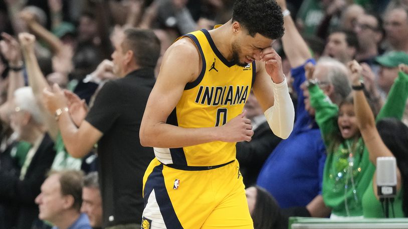 Indiana Pacers guard Tyrese Haliburton (0) reacts after missing a shot against the Boston Celtics to end regulation time in Game 1 of the NBA Eastern Conference basketball finals, Tuesday, May 21, 2024, in Boston. (AP Photo/Charles Krupa)