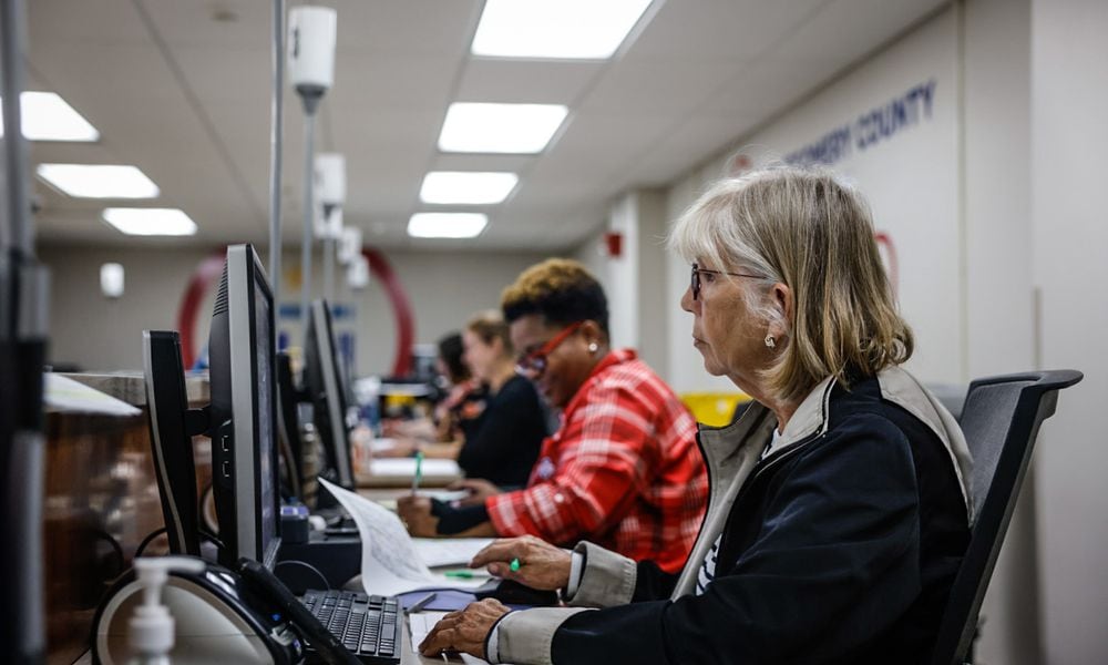 Montgomery County Board of Election workers check voter registration data on Friday, Sept. 13, 2024. JIM NOELKER/STAFF