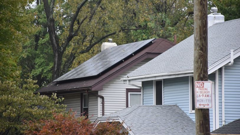 Solar panels on the roof of a home in Dayton. CORNELIUS FROLIK / STAFF