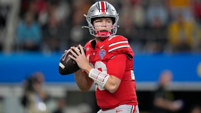 FILE - Ohio State quarterback Devin Brown passes against Missouri during the first half of the Cotton Bowl NCAA college football game, Dec. 29, 2023, in Arlington, Texas. (AP Photo/Julio Cortez, File)