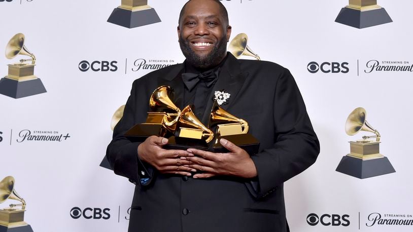 FILE - Killer Mike poses in the press room with the awards for best rap performance and best rap song for "Scientists & Engineers," and best rap album for "Michael" during the 66th annual Grammy Awards on Sunday, Feb. 4, 2024, in Los Angeles. Killer Mike is expected to avoid charges over a physical altercation that led to his arrest at the Grammys earlier this year after the rapper recently completed community service. (Photo by Richard Shotwell/Invision/AP)