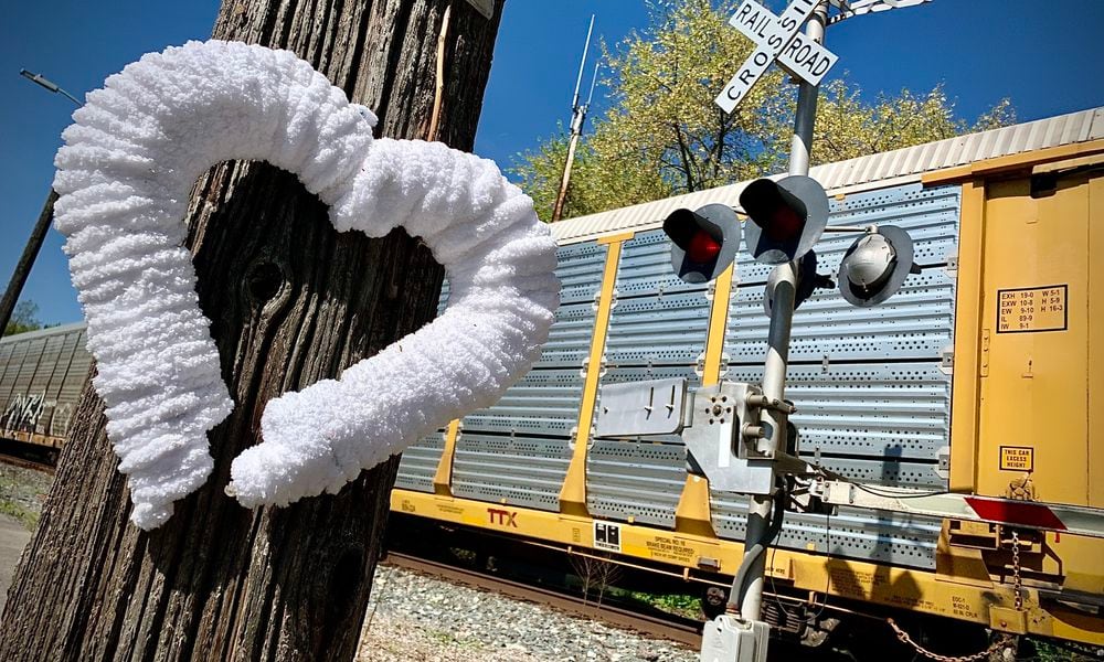 A broken heart memorial marks the railroad crossing at West Walnut Street in Tipp City, where Cynthia Steele, 47, was struck and killed by a CSX train April 8, 2024. MARSHALL GORBY\STAFF