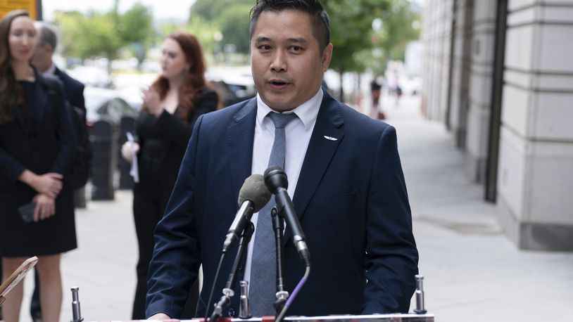 TikTok content creator Paul Tran talks to the press as he leaves the federal courthouse in Washington, Monday, Sept. 16, 2024, after a hearing on TikTok's lawsuit against the federal government. (AP Photo/Jose Luis Magana)