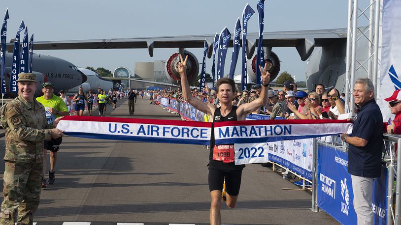 Jason Salyer of Tipp City, the 2022 Air Force Marathon champion, crosses the finish line with a time of 2 hours, 27 minutes, 23 seconds.  U.S. AIR FORCE PHOTO/R.J. ORIEZ