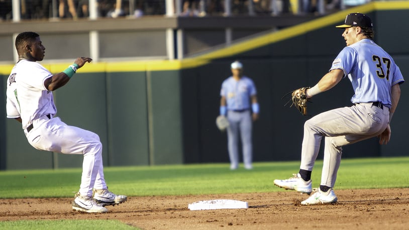 Dayton's Carlos Jorge beats Lake County second baseman Travis Bazzana back to second to avoid being doubled up on a popup while trying to steal third base Tuesday night at Day Air Ballpark. Jeff Gilbert/CONTRIBUTED