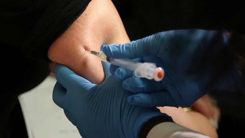 FILE - In this March 27, 2019, file photo, a woman receives a measles, mumps and rubella vaccine at the Rockland County Health Department in Pomona, N.Y. Measles outbreaks in the U.S. and abroad are raising health experts' concern about the preventable, once-common childhood virus. The CDC on April 11, 2024 released a report on recent measles case trends, noting that cases in the first three months of this year were 17 times higher than the average number seen in the first three months of the previous three years. (AP Photo/Seth Wenig, File)