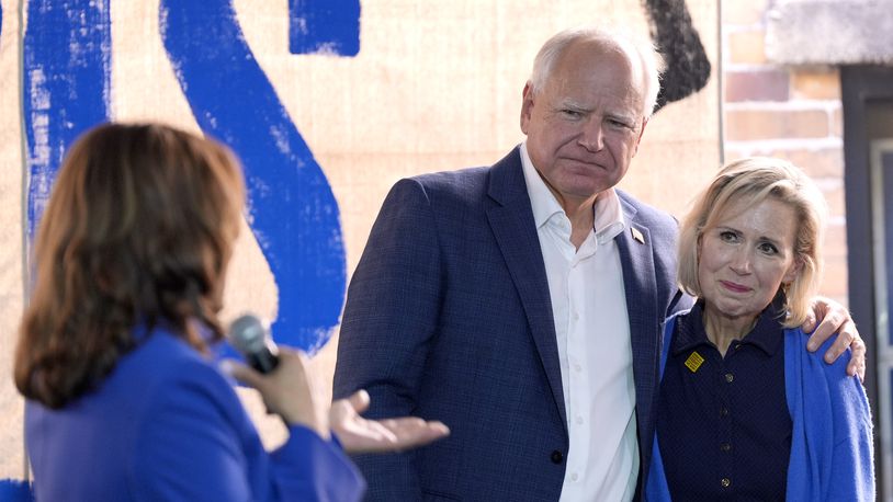 Democratic presidential nominee Vice President Kamala Harris, from left, addresses Democratic vice presidential nominee Minnesota Gov. Tim Walz and his wife Gwen Walz at a campaign event, Sunday, Aug. 18, 2024, in Rochester, Pa. (AP Photo/Julia Nikhinson)