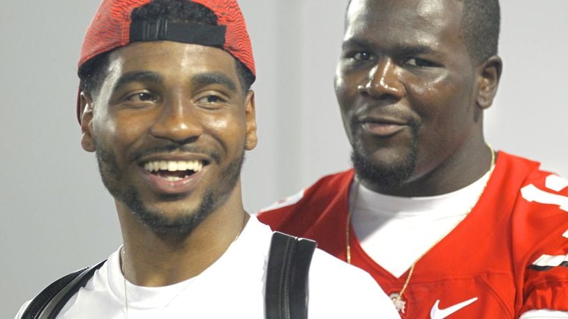 Braxton Miller, left, and Cardale Jones share a laugh during Ohio State football media day on Sunday, Aug. 16, 2015, at the Woody Hayes Athletic Center in Columbus. David Jablonski/Staff