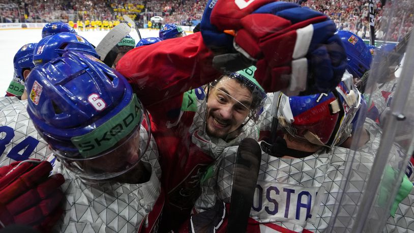 Czech Republic's David Tomasek, center, celebrates with teammates after the semifinal match between Czech Republic and Sweden at the Ice Hockey World Championships in Prague, Czech Republic, Saturday, May 25, 2024. (AP Photo/Petr David Josek)