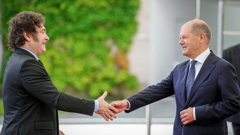 German Chancellor Olaf Scholz, right, and Argentina's President Javier Milei shake hands during their meeting at the chancellery in Berlin, Germany, Sunday, June 23, 2024. (Kay Nietfeld/dpa via AP)