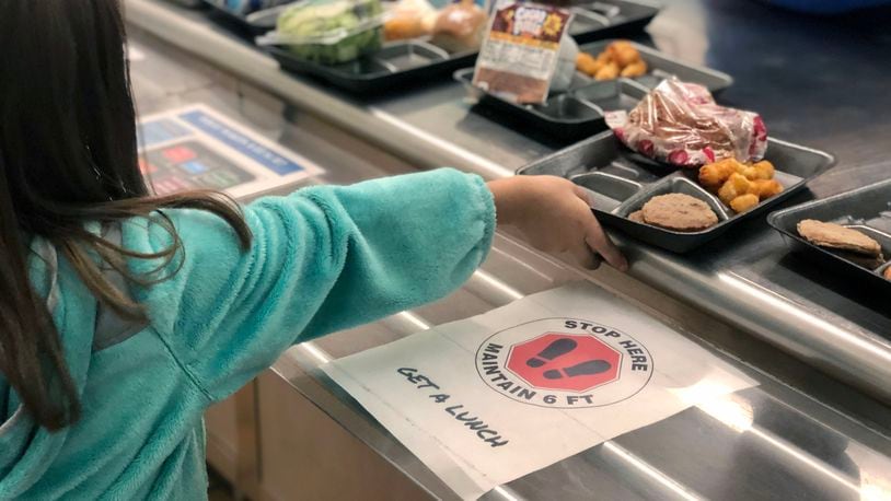 A second grader at Cline Elementary in Centerville gets served lunch. File photo from Centerville Schools.