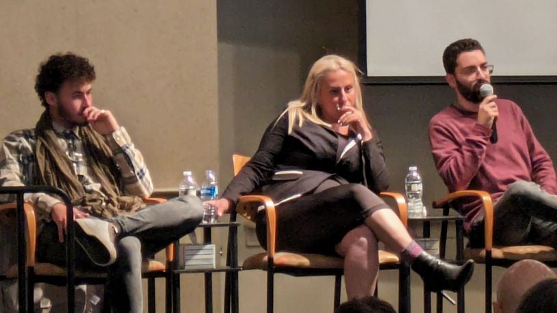 Israeli survivors from the Oct. 7 Hamas attacks in southern Israel talk to members of the Dayton Jewish Community Center on Tuesday evening. From left to right, Klil Valiano, a Nova Festival attendee on Oct. 7; Gitit Botera, who took shelter in the Kibbutz Sderot; and Eitan Frankl, who took shelter in the Kibbutz Nirim. SAMANTHA WILDOW\STAFF