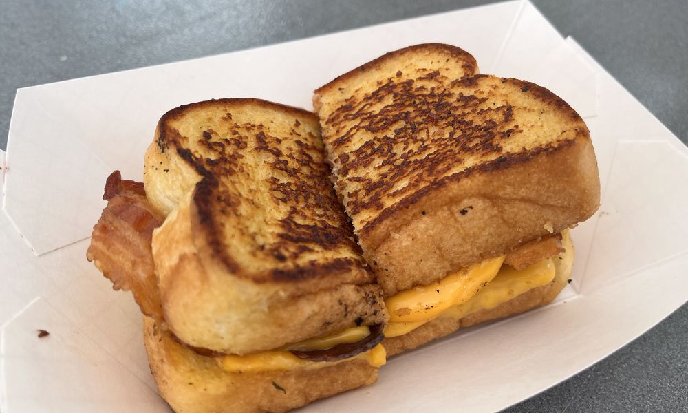 Just over a dozen food trucks on Saturday, Aug. 3, 2024 put their spin on what it means to have bacon at the forefront during Bacon Fest at the Fraze Pavilion in Kettering. NATALIE JONES/STAFF