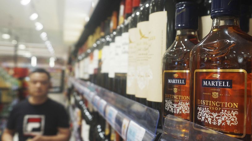 Bottles of brandy are seen on a shelf at a supermarket in Hangzhou in eastern China's Zhejiang province Tuesday, Oct. 08, 2024. Chinese drinkers may pay more for Remy Martin and other European brandies after the government announced provisional tariffs of 30.6% to 39% on those liquors Tuesday, four days after a majority of European Union countries approved duties on electric vehicles made in China. (Chinatopix Via AP)