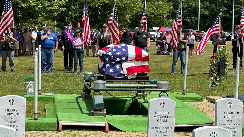 Former U.S. Marine Gerry Brooks is laid to rest Thursday, June 20, 2024 at the Maine Veterans Memorial Cemetery in Augusta, Maine. Hundreds of people attended the funeral after Brooks died alone last May and a funeral home asked for volunteers to serve as pallbearers. (AP Photo/Patrick Whittle)