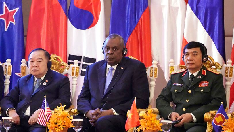 FILE - U.S. Secretary of Defense Lloyd Austin, center, Vietnam Minister of Defense Phan Van Giang, right, and Thai Deputy Prime Minister Prawit Wongsuwon, left, listen to a speech by Cambodian Prime Minister Hun Sen, during the 9th ASEAN Defense Ministers' Meeting Plus in Siem Reap, Cambodia, Wednesday, Nov. 23, 2022. U.S. Defense Secretary Lloyd Austin is scheduled to make an official visit to Cambodia, one of China's closest allies in Southeast Asia, after holding talks with his Chinese counterpart at an annual security conference in Singapore, officials said in a statement issued Friday, May 24, 2024. (AP Photo/Heng Sinith, File)