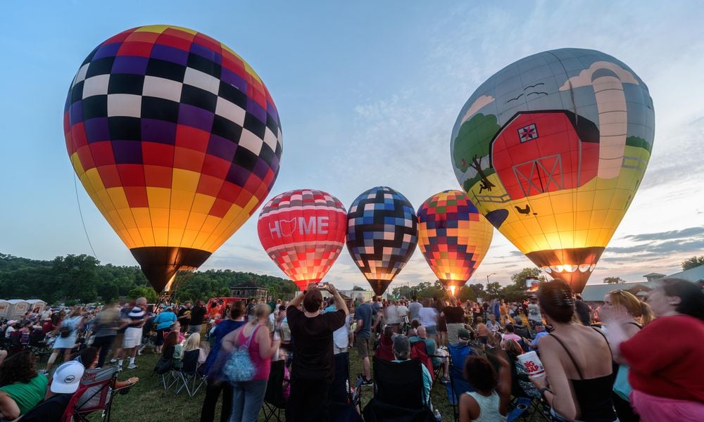 The City of West Carrollton hosted a hot air balloon glow by the Askren Air Balloon Team with food trucks, beer and a concert featuring The Fries Band on Friday, July 12, 2024 at 1 S. Elm St. TOM GILLIAM / CONTRIBUTING PHOTOGRAPHER