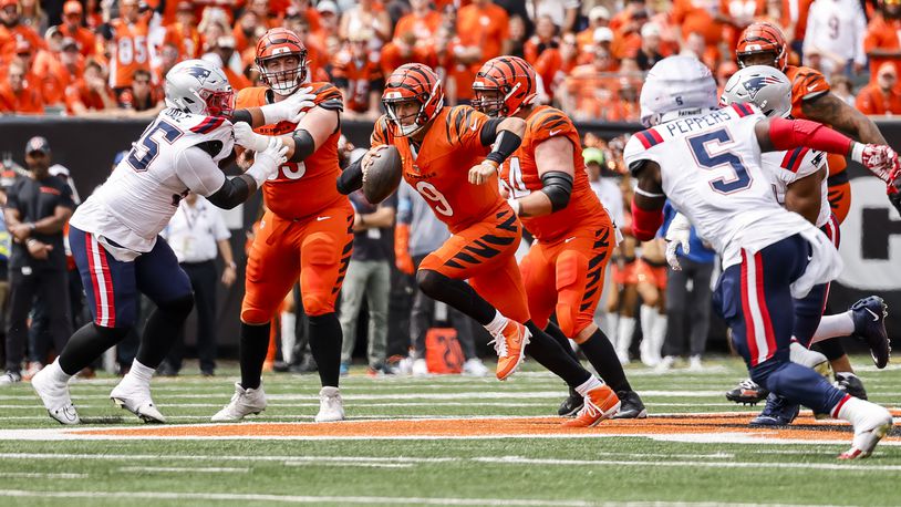 Bengals quarterback Joe Burrow runs the ball during their 16-10 loss to New England Patriots Sunday, Sept. 8, 2024 at Paycor Stadium in Cincinnati. NICK GRAHAM/STAFF