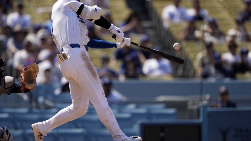 Los Angeles Dodgers' Shohei Ohtani hits a solo home run during the fifth inning of a baseball game against the Cleveland Guardians, Sunday, Sept. 8, 2024, in Los Angeles. (AP Photo/Mark J. Terrill)