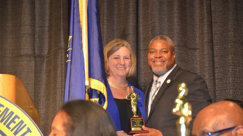 Former Dayton Mayor Nan Whaley receives the 2023 Dayton NAACP President's Award of Freedom from organization President Derrick Foward.