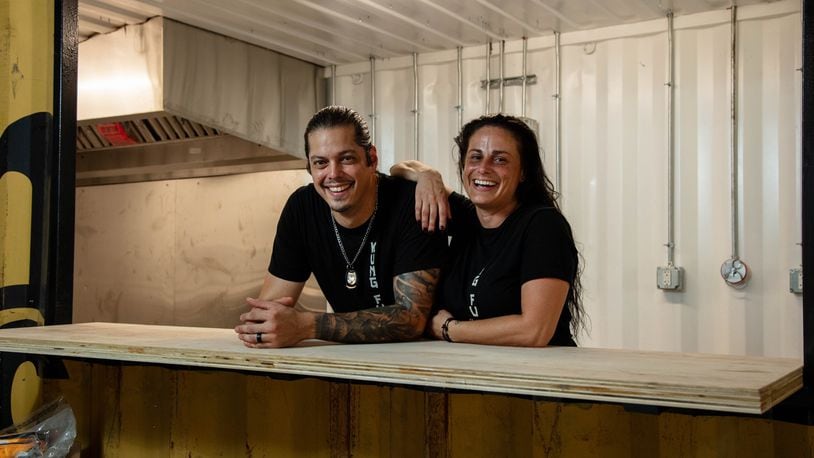 KungFu BBQ will serve worldly-inspired cuisine with a unique smoked interpretation at The Silos, a new food hall and beer garden expected to open in the fall near 2nd Street Market in downtown Dayton. Pictured are owners Nate and Marie Lansangan (CONTRIBUTED PHOTO).