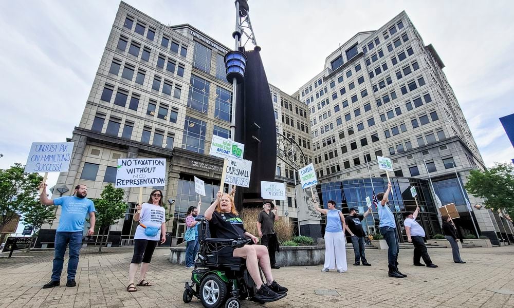 Concerned citizens rally against the Miami Conservancy District assessment increase in front of the Hamilton Municpal Building before a special meeting to discuss the issue Thursday, April 18, 2024 in Hamilton. NICK GRAHAM/STAFF