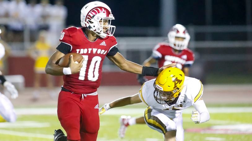 Trotwood-Madison quarterback Timothy Carpenter looks for room to run vs. Alter during a game on Sept, 8, 2022. Michael Cooper/CONTRIBUTED